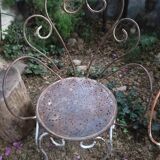 Duo of iron lawn chairs