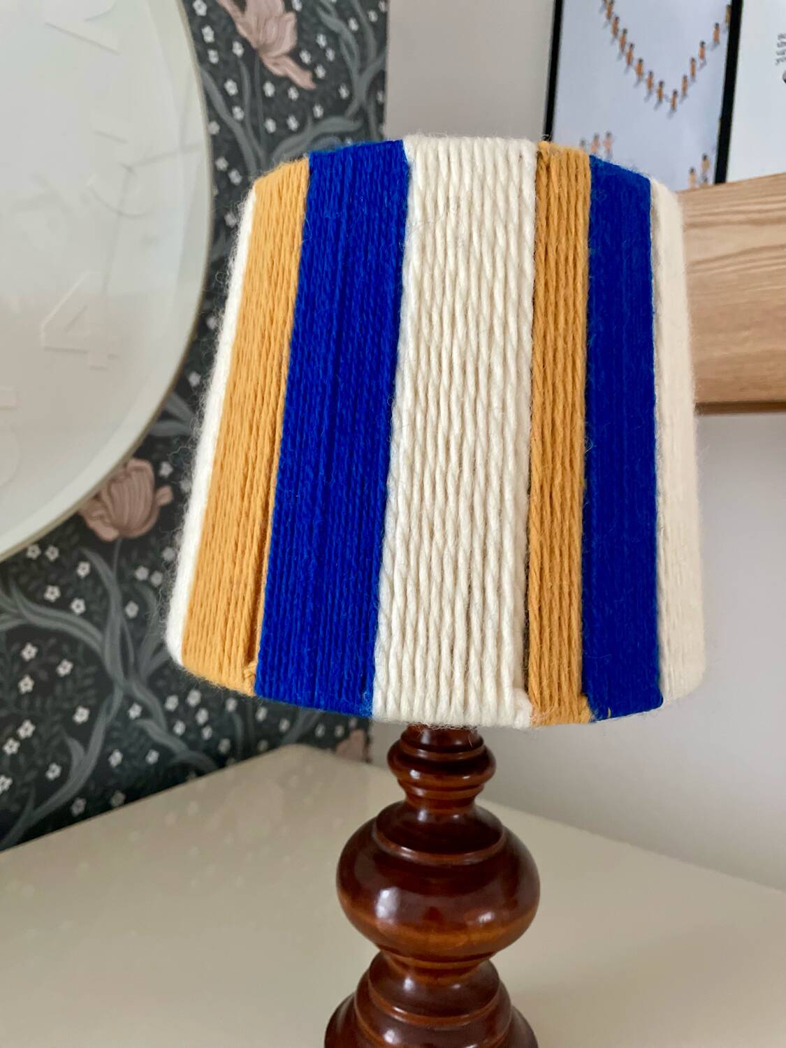 Vintage lamp with turned wooden base, striped wool lampshade