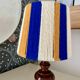 Vintage lamp with turned wooden base, striped wool lampshade