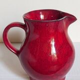 Vintage red enamel ceramic pitcher