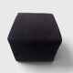 Minimalist square pouffe in black suede