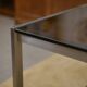Brushed stainless steel and smoked black glass desk from the 1980s.