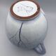 Blue glazed terracotta pitcher with hand-painted decoration, signed