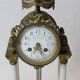 Clock and pair of Louis XVI style candelabras.