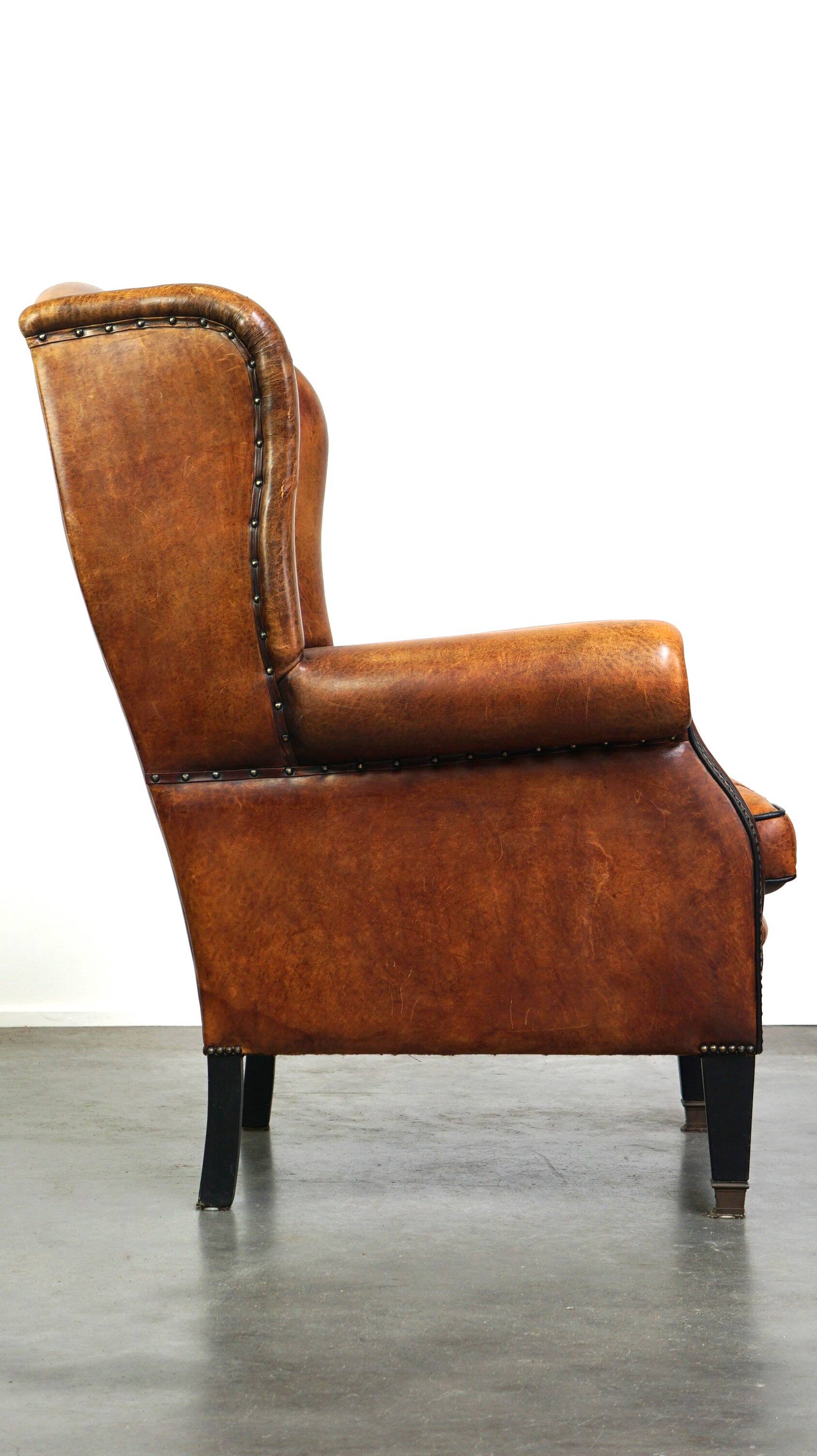 Sheepskin leather chair with a beautiful patina