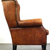 Sheepskin leather chair with a beautiful patina