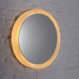 Bright round mirror in plexiglass