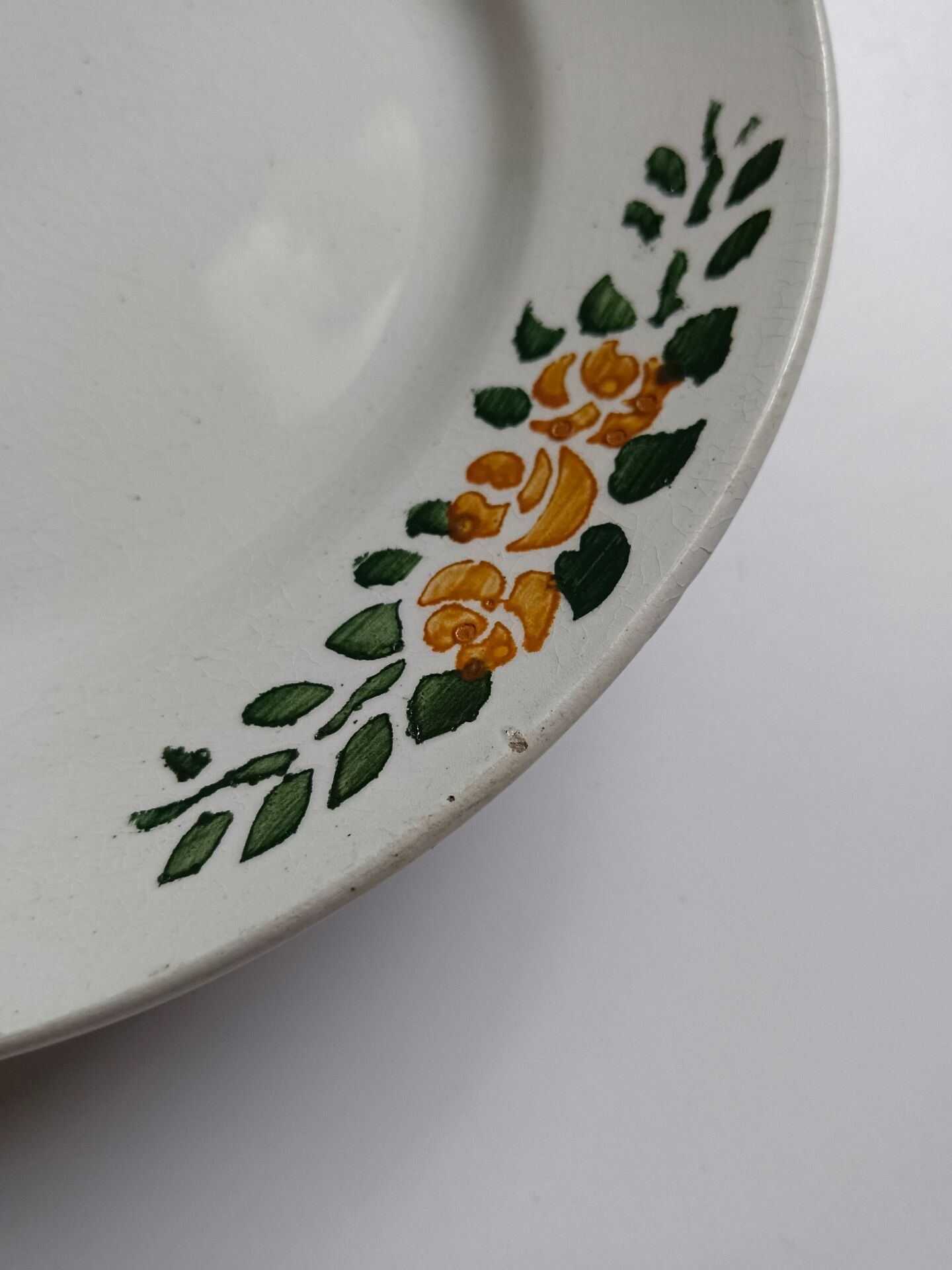 Old round footed plate signed Labrut brothers flowers