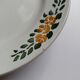 Old round footed plate signed Labrut brothers flowers