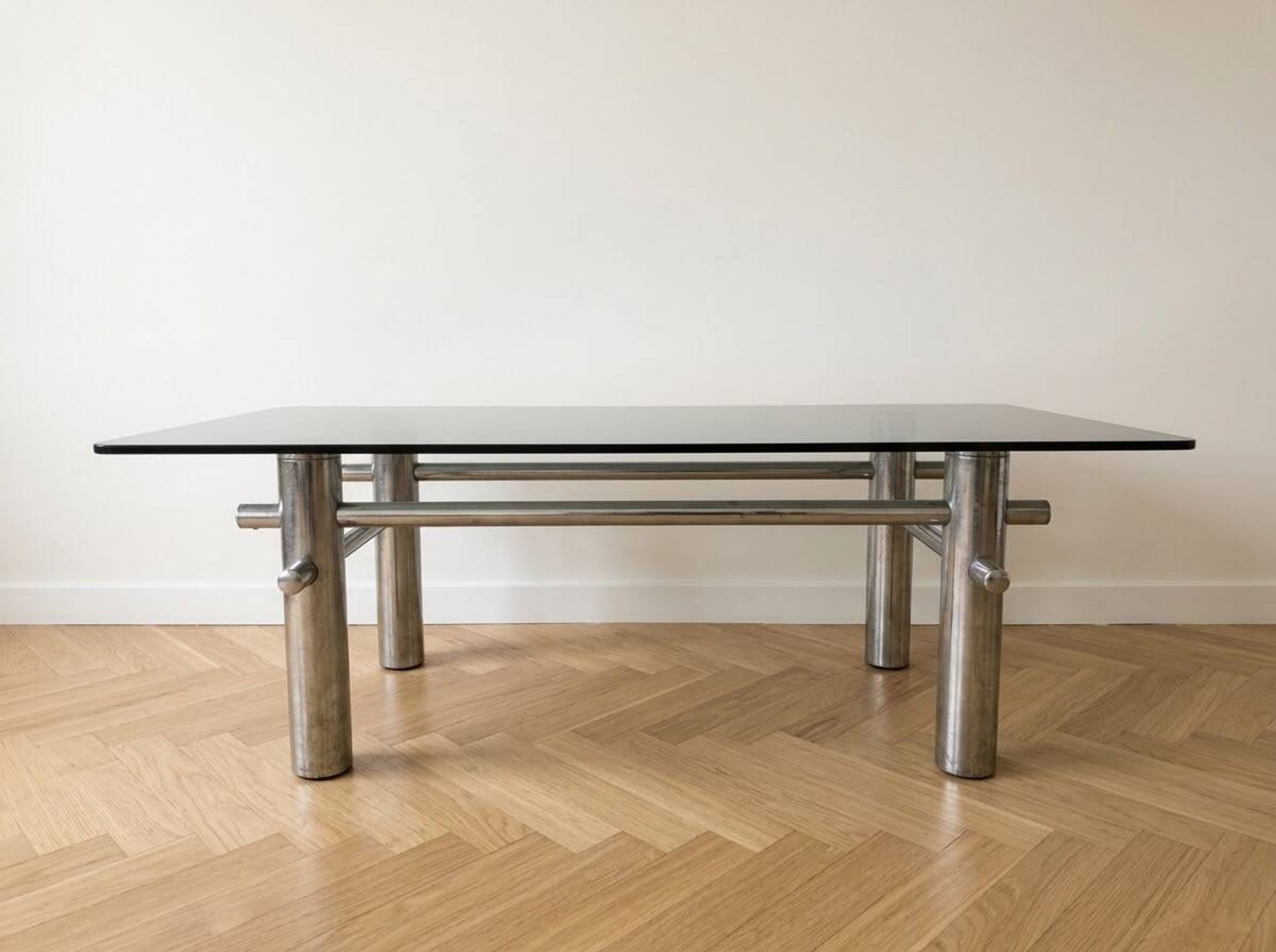 Vintage 1970s coffee table in smoked glass and chrome metal.
