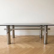 Vintage 1970s coffee table in smoked glass and chrome metal.