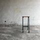 Upcycled industrial laboratory stool, black/grey metal frame with natural wood seat, mid-20th century