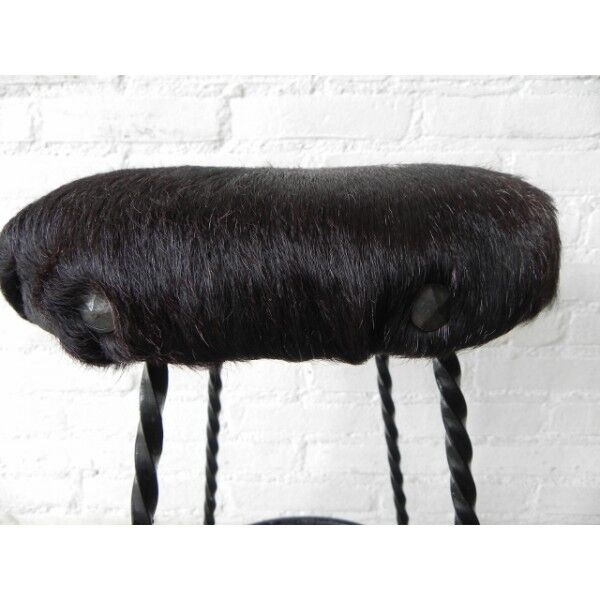 Vintage stool lined with cowhide