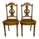 Paire de chaises de musiciens en bois sculpté et doré de style Louis XVI