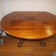 Square cherry wood table with drop leaves.