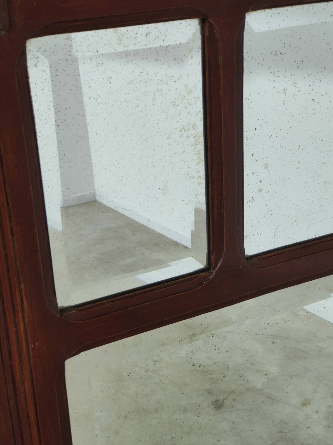 Antique beveled mirror on a wooden frame, 1930