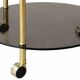 Brass and glass serving table with wheels — Art Deco style