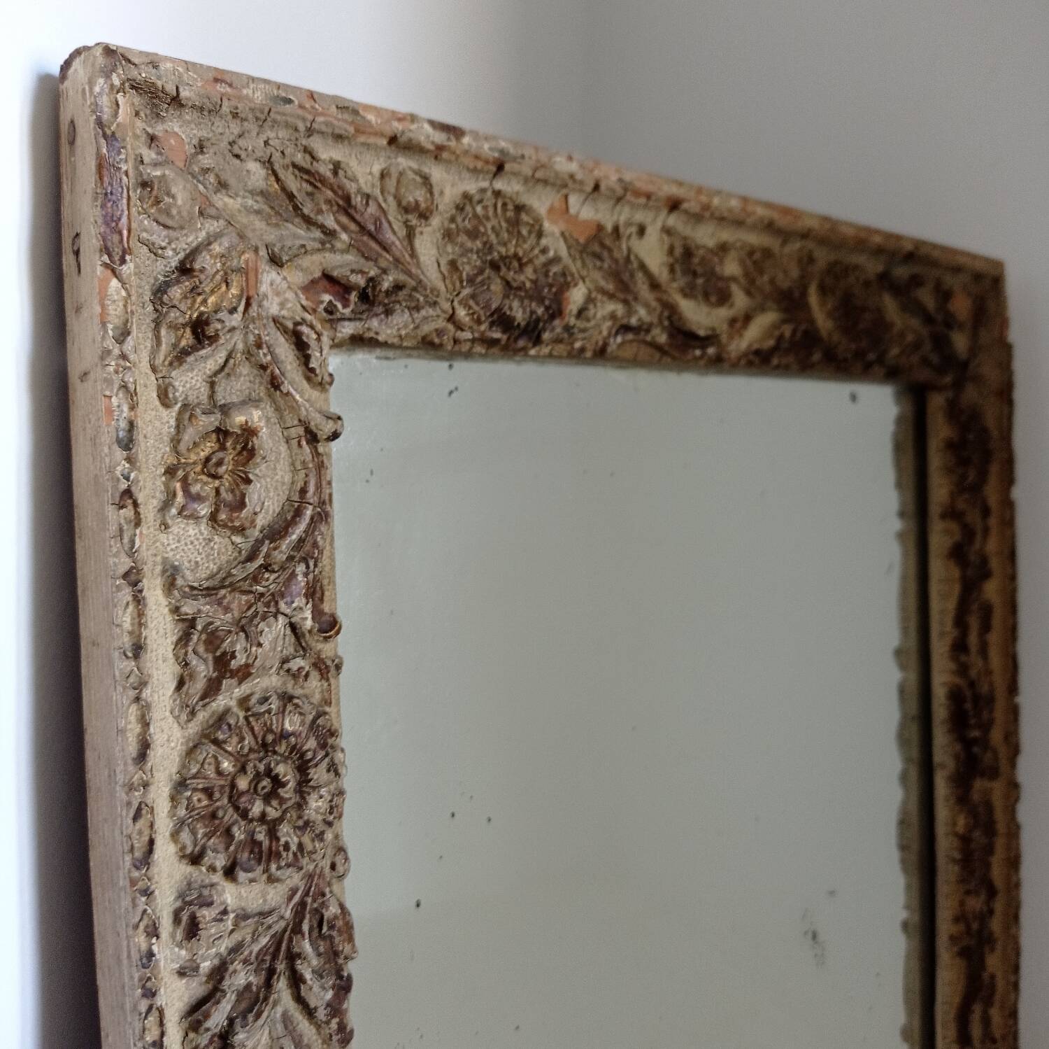 Wood and patinated stucco mirror