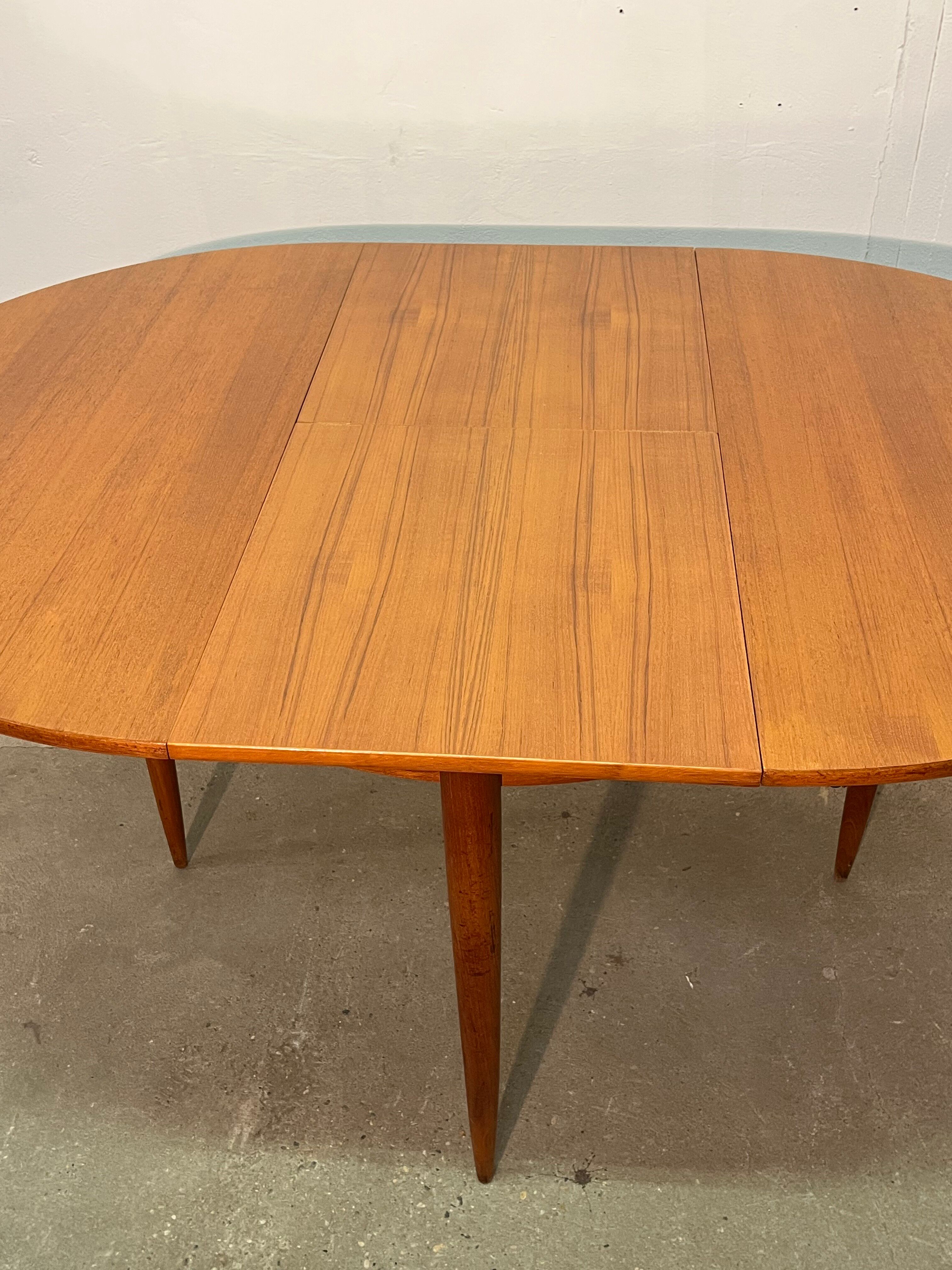 Vintage 1960s teak extendable Scandinavian table.