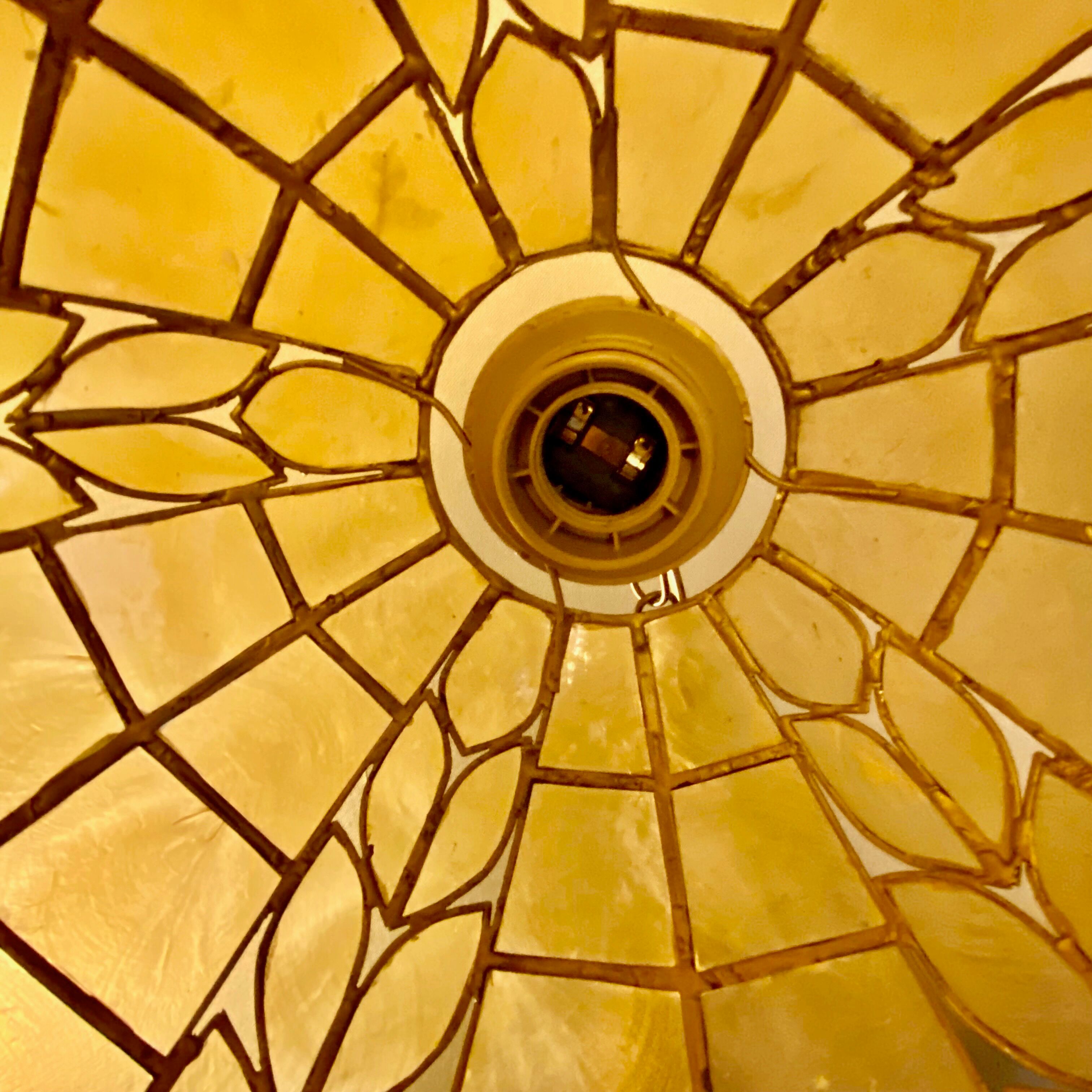 Mother-of-pearl and brass suspension