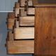 Antique Victorian oak kneehole desk with 18 double-sided drawers.