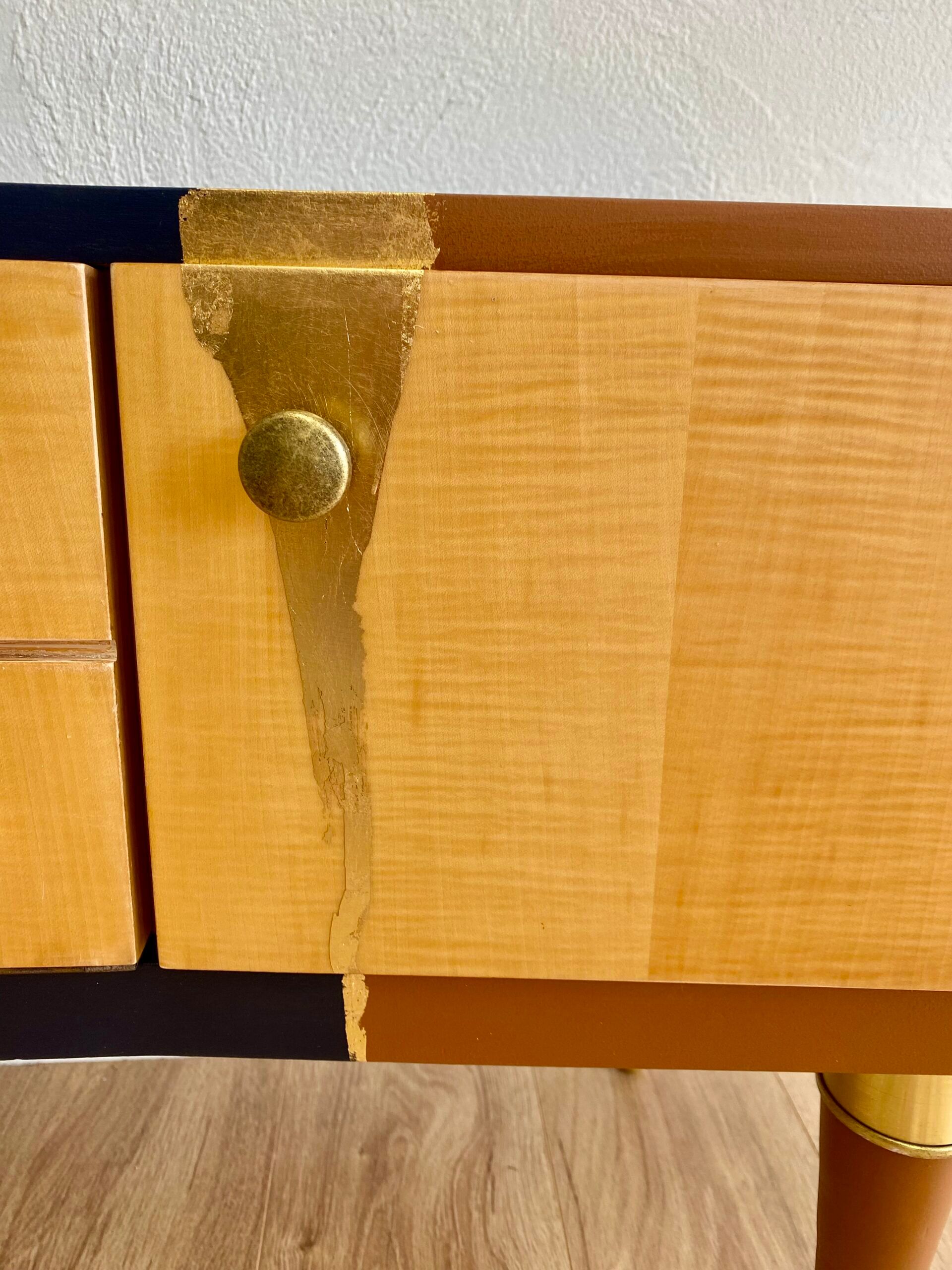 Vintage furniture revamped in navy blue, terracotta, and gold leaf – Reimagined mid-century style.