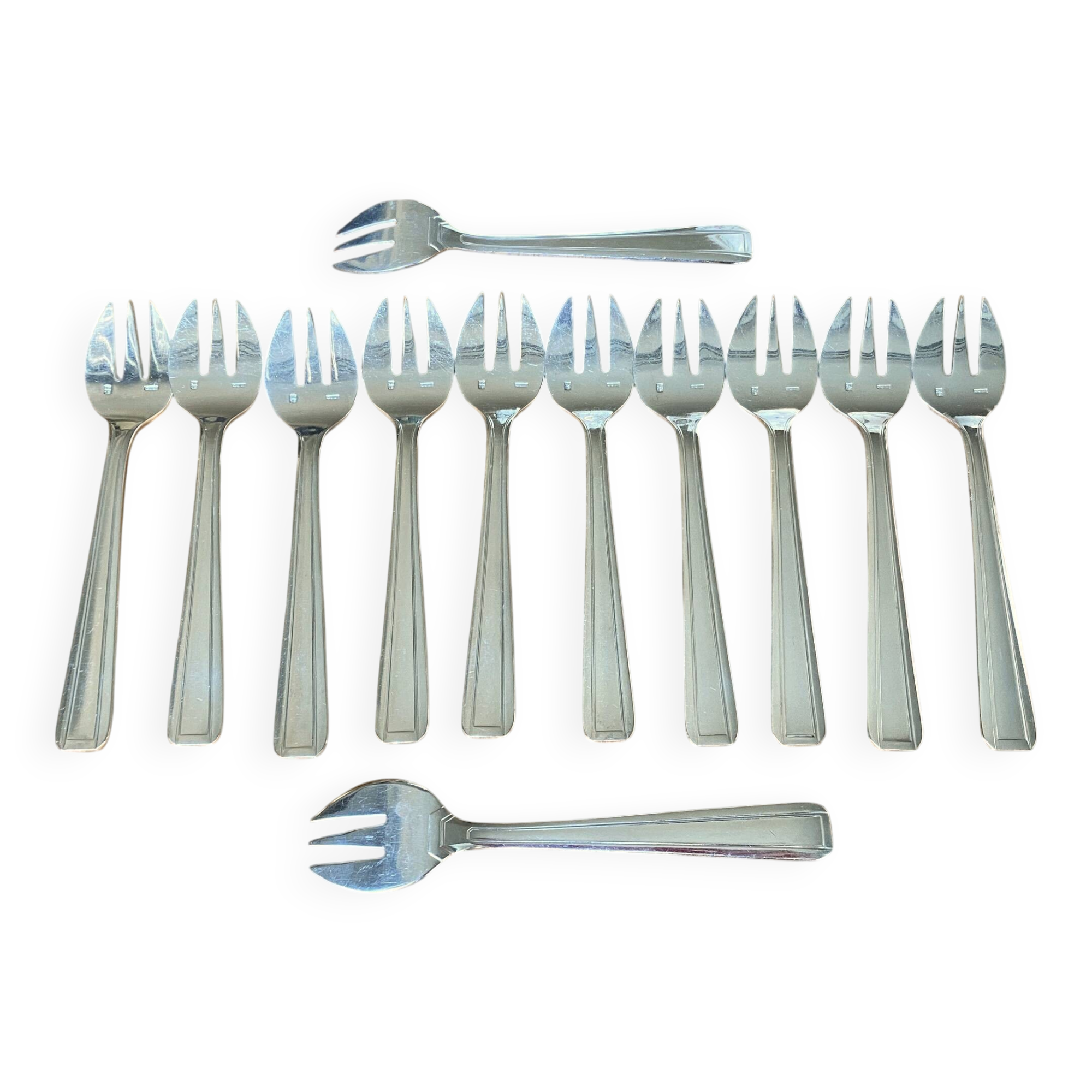 12 Art Deco oyster forks in silver plated metal by Apollo goldsmiths