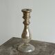 Antique mercury glass candlestick with a patina and silver finish.