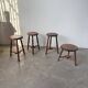 Set of 4 turned oak stools.