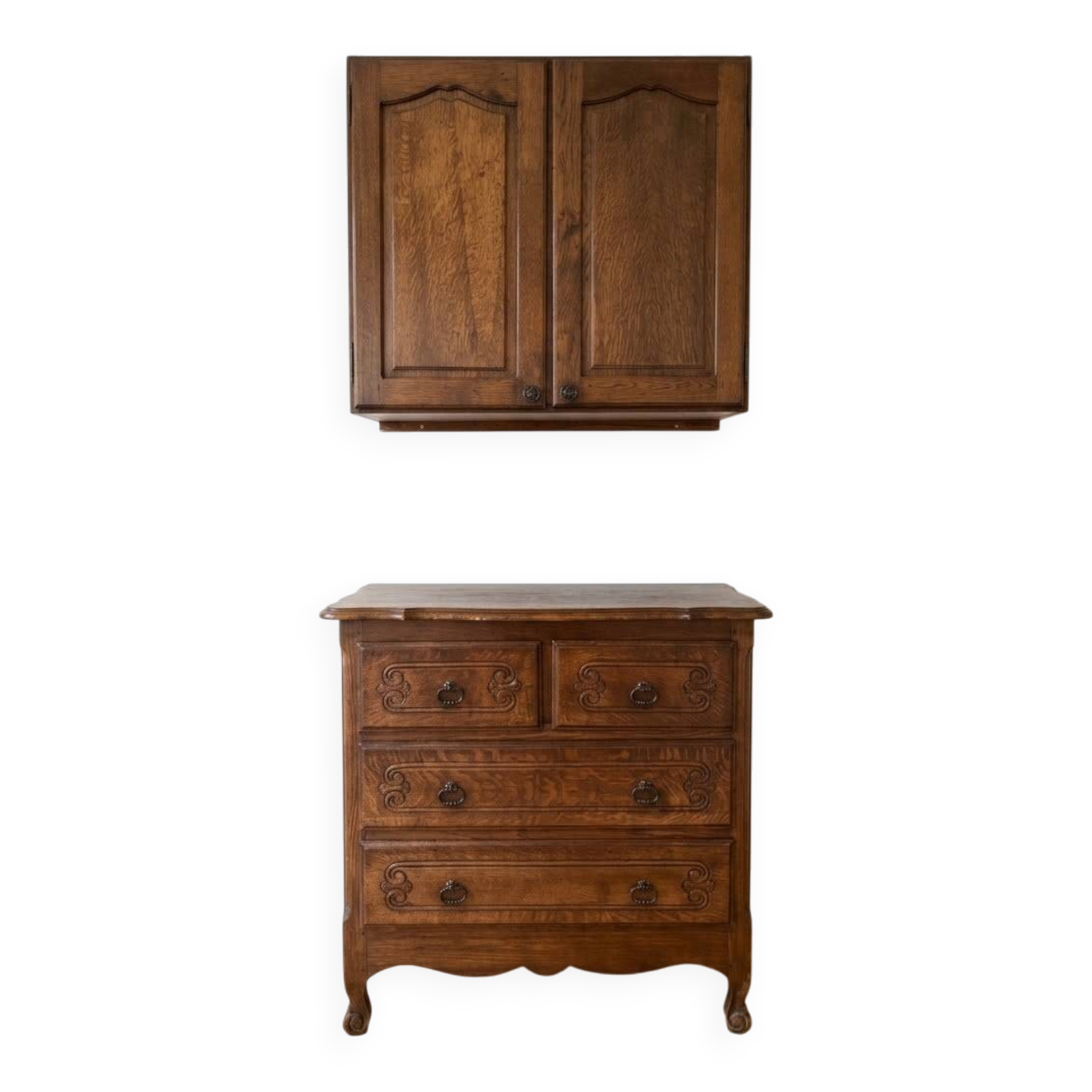Set of chest of drawers and tall antique furniture in dark oak.