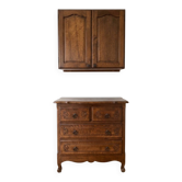 Set of chest of drawers and tall antique furniture in dark oak.