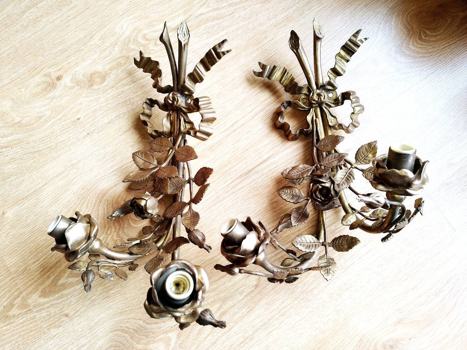 Pair of bronze and gilded metal wall sconces in the Louis XVI style.