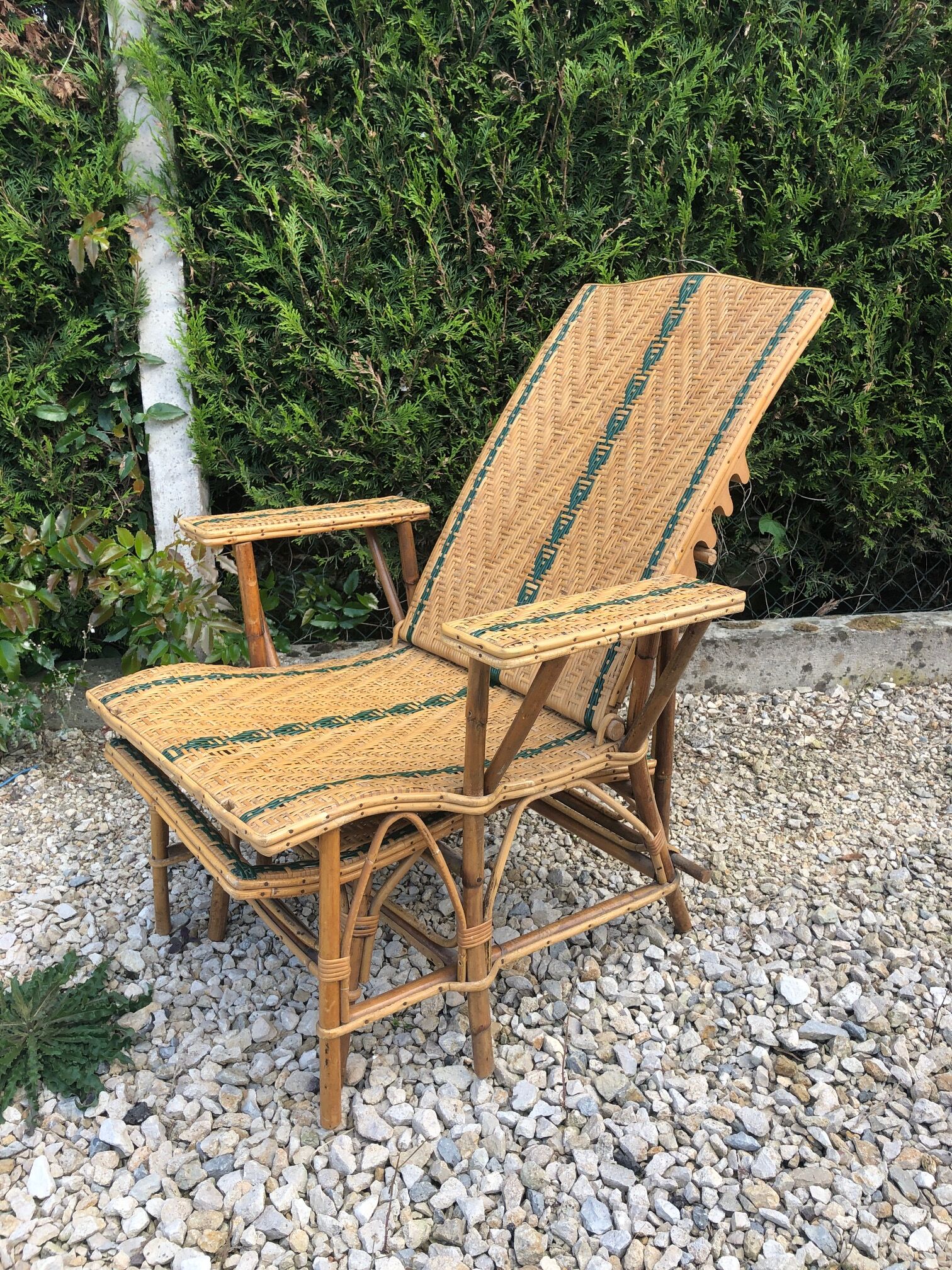 Rattan lounger with foot rest