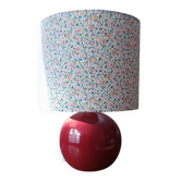 Red bedside lamp, liberty lampshade with small pink flowers.