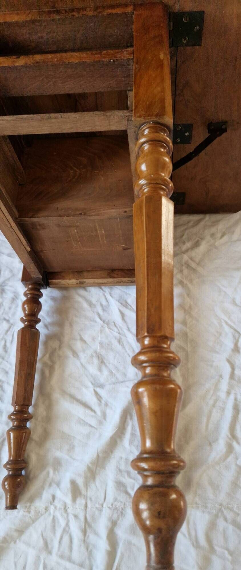 Nineteenth-century walnut work table with flaps, large storage + secret drawer.