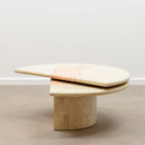 Travertine coffee table with swiveling top.