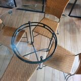 Glass and metal table and its 4 wicker chairs and glass Roche Bobois