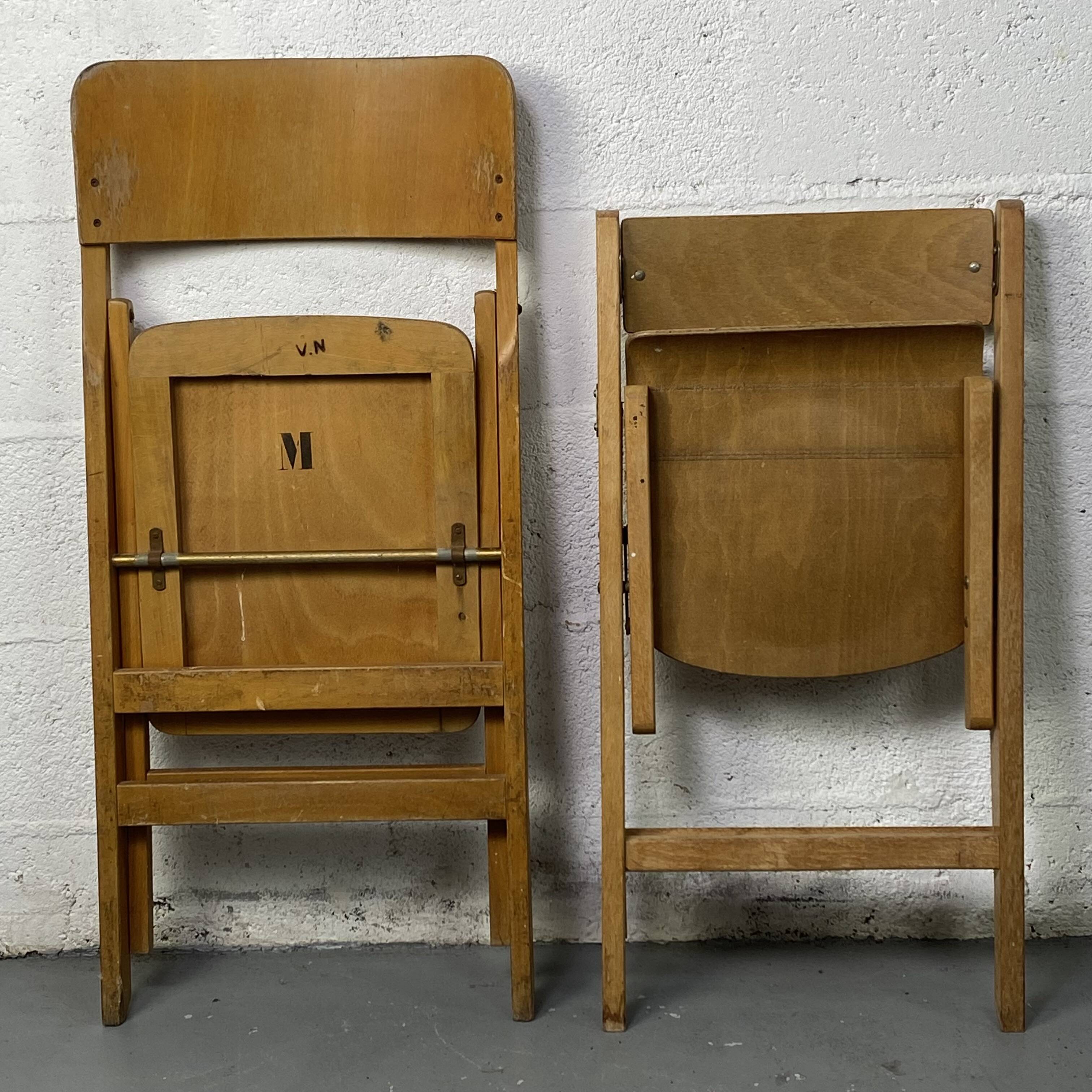 Pair of mismatched wooden folding chairs