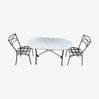 Oval carrara marble table (fixed) and two cast iron chairs