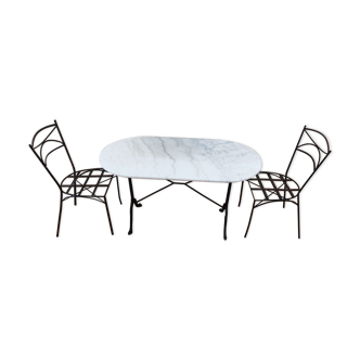 Oval carrara marble table (fixed) and two cast iron chairs