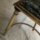 Gold bronze and marble coffee table, tapered feet decorated with Egyptian capitals