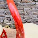 Pair of red rattan chairs and fabric
