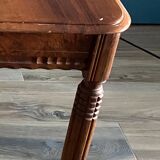 Old table in varnished solid wood