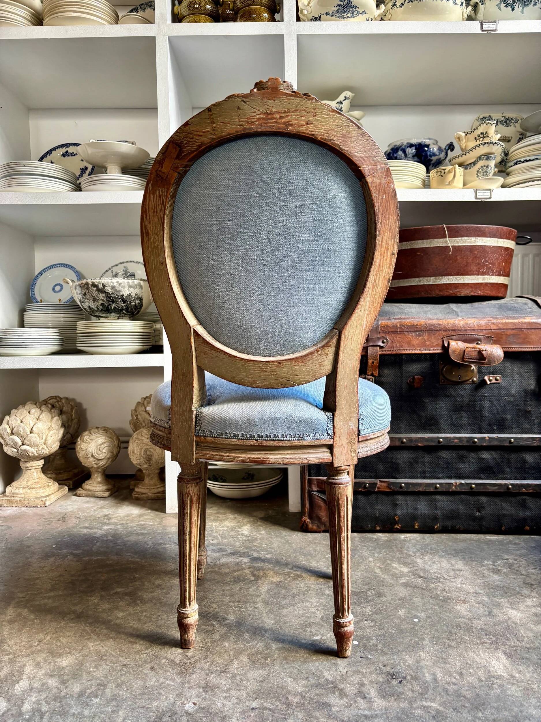 Medallion back chair in reclaimed wood and blue cotton.