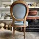 Medallion back chair in reclaimed wood and blue cotton.