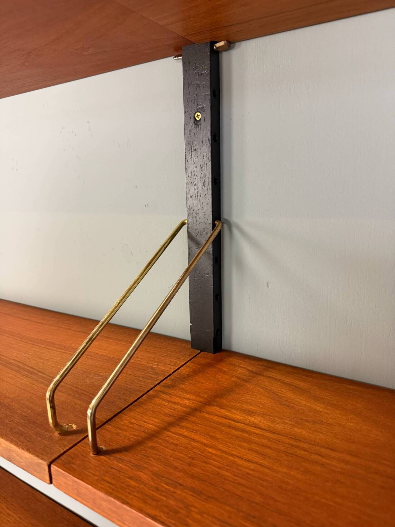 Modular wall shelf in teak in mid-century modern style, designed by Poul Cadovius for Cado, 1960.