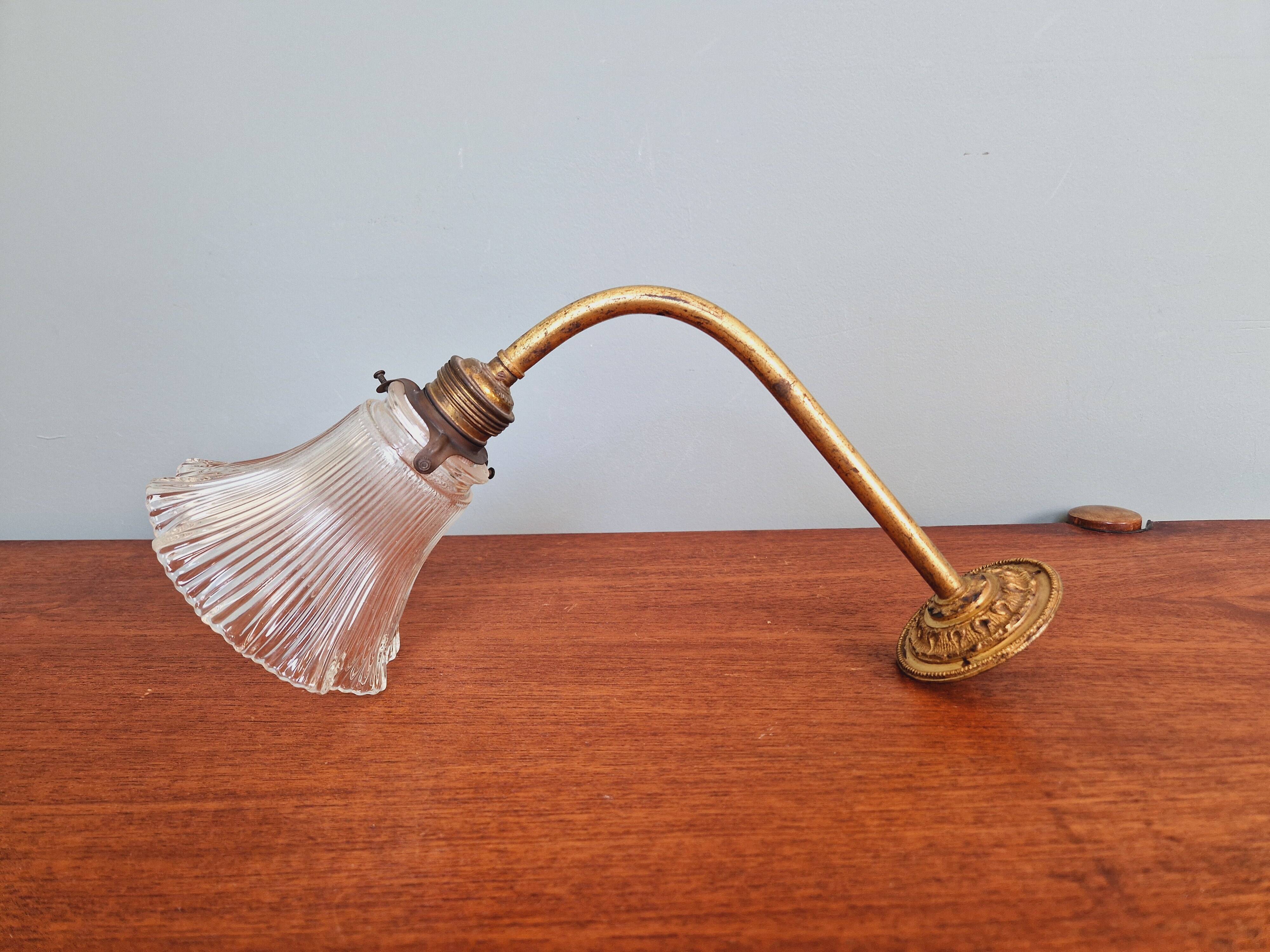 Bronze wall light with grooved clear glass, early 20th century