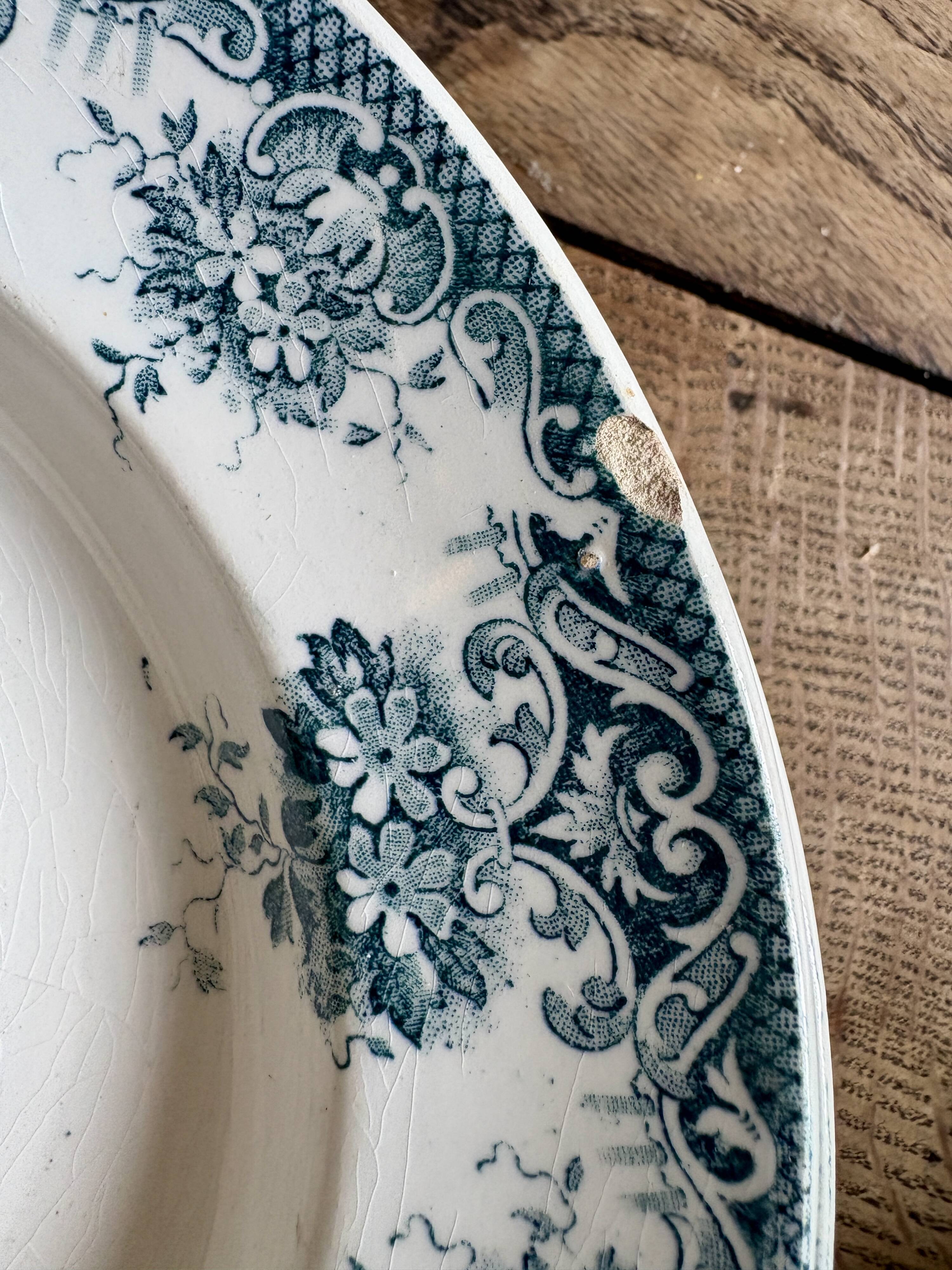 Set of 8 mismatched antique ironstone deep plates.