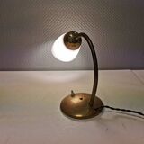 Beautiful table lamp, estimated from the 1950-60s. Made of metal, brass and glass.
