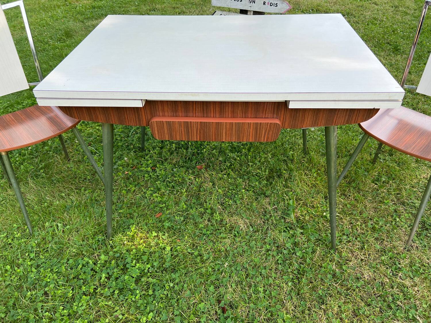 White Formica table with extensions and 2 designer chairs